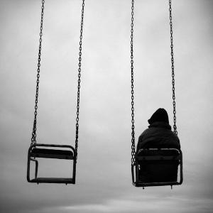 Boy alone on swing